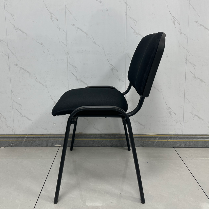Armless Architectural Silhouette: Clean, space-saving profile allows unhindered movement and allows chairs to tuck neatly under any boardroom table. Contoured Ergonomic Support: Curved backrest supports natural spinal posture to keep attendees comfortable through long meetings and seminars. Plush Fabric Cushioning: Upholstered in high-density, wear-resistant black woven fabric designed for daily commercial use and easy maintenance. Heavy-Duty Steel Four-Leg Base: Powder-coated tubular steel frame provides exceptional load-bearing stability and long-lasting durability. Protective Floor Glides: Leg bases are fitted with non-marking glides to protect hardwood, tile, and commercial carpet from scuffs and scratches.
